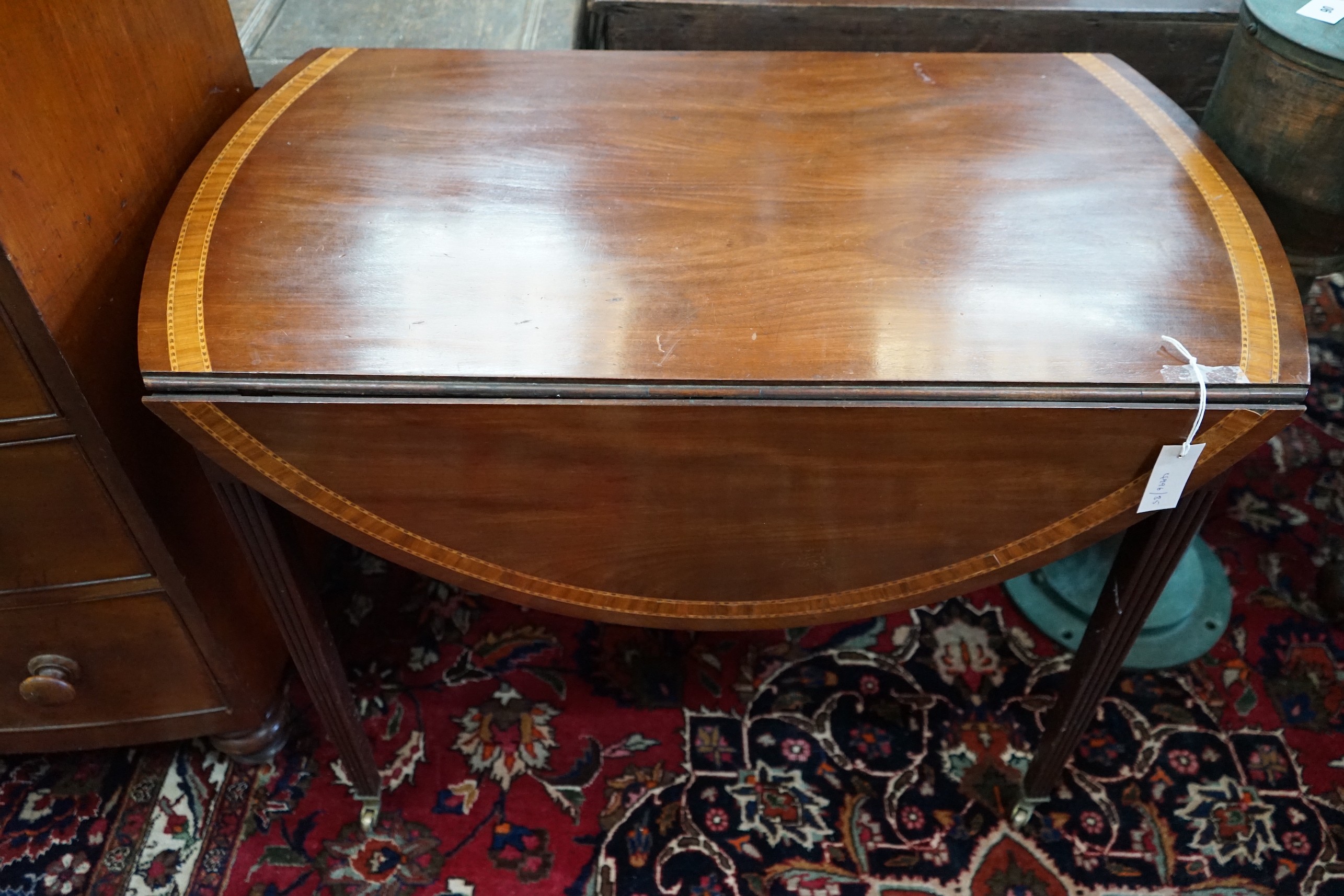 A George III and later satinwood banded mahogany oval Pembroke table, width 99cm, depth 56cm, height 75cm